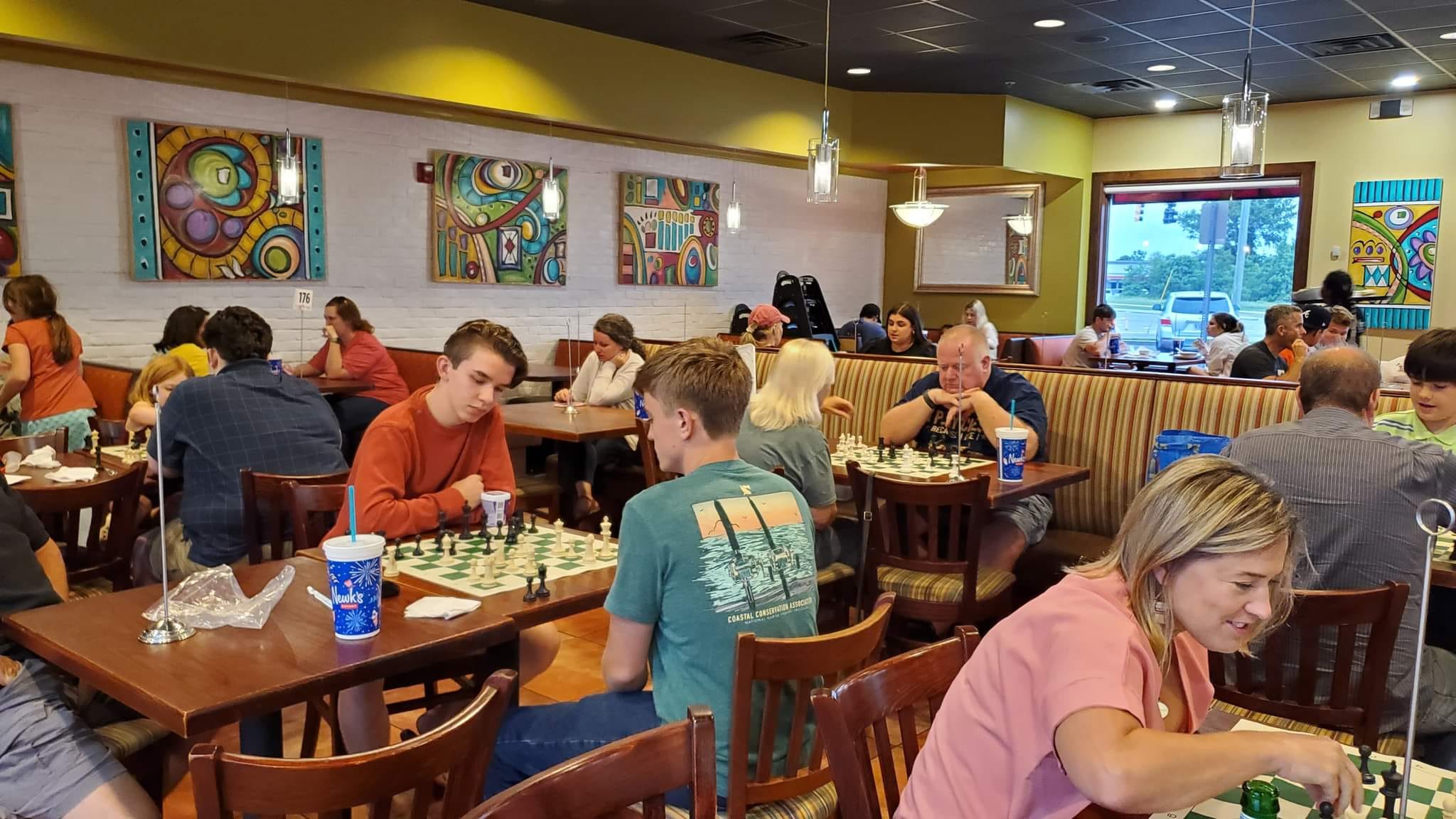 People learning chess.